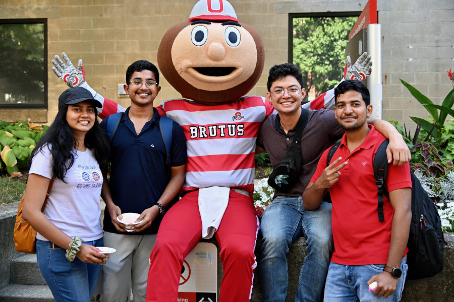A diverse group of students participating in a lively student organization event.